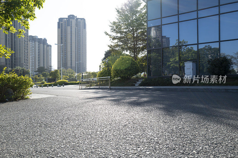 city ​​buildings beside asphalt road